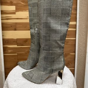 Silver and gray heeled boots.